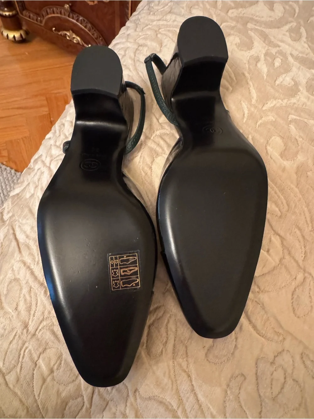 CHANEL Black Patent Leather Slingback Pumps with Cap Toe